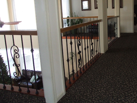 Wood Trim at floor under spindles create a finished look